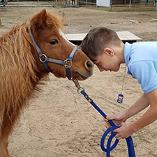 Aden Kovacic and Chips the horse.