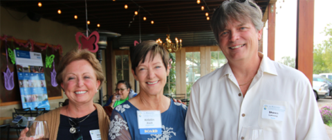 Kris Zook (middle) poses with guests Shelly and Shawn Larvenz at the Ramona Community Foundation Spring Fling at  the Turtle Rock Ridge Winery