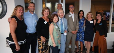 Carlsbad Charitable Foundation members celebrate Knox Williams (middle in blue) as he is awarded the first-ever Knox Williams Philanthropy Award at the summer mixer.