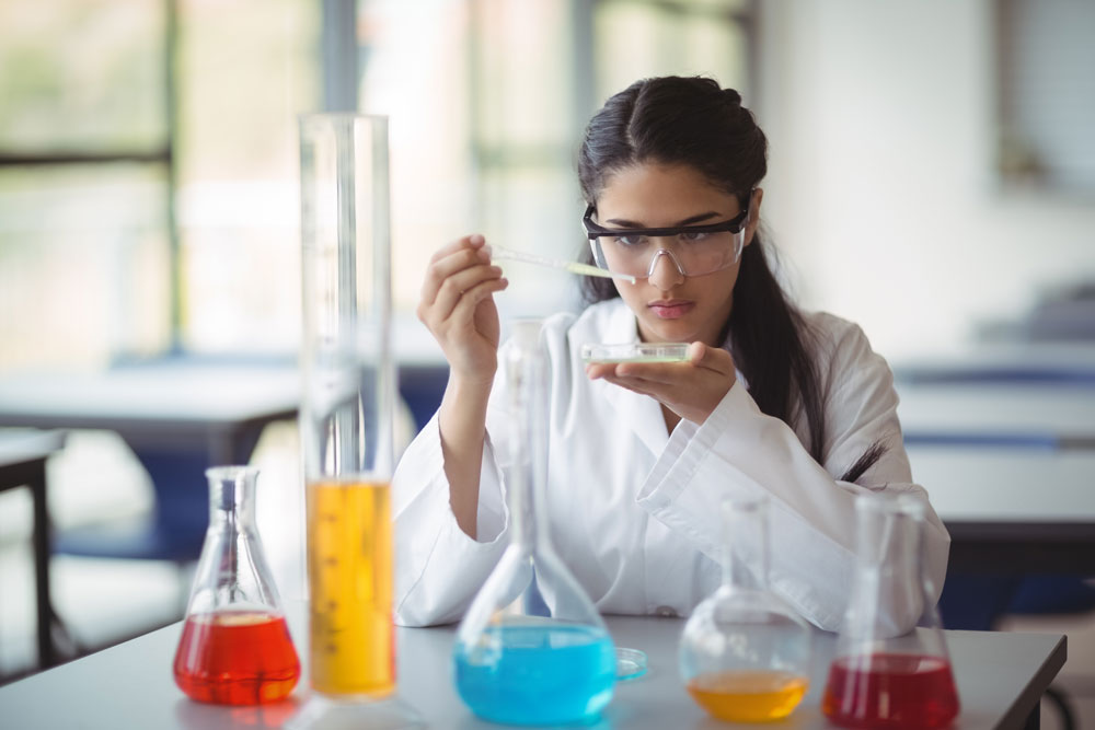 Young woman intently working in a lab