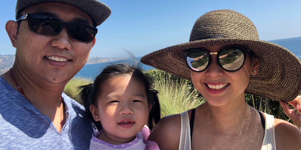Elvin Lai and his wife and daughter