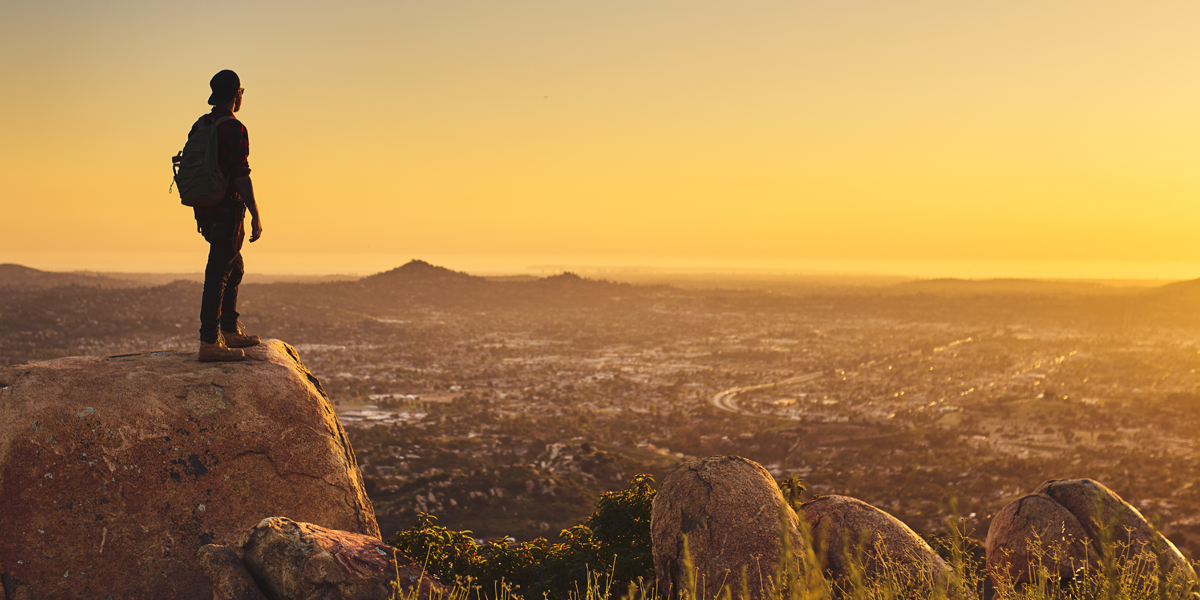 Man looking out on a mountain in San Diego