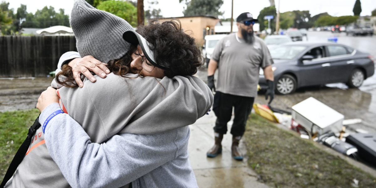 San Diego residents affected by the floods comfort each other