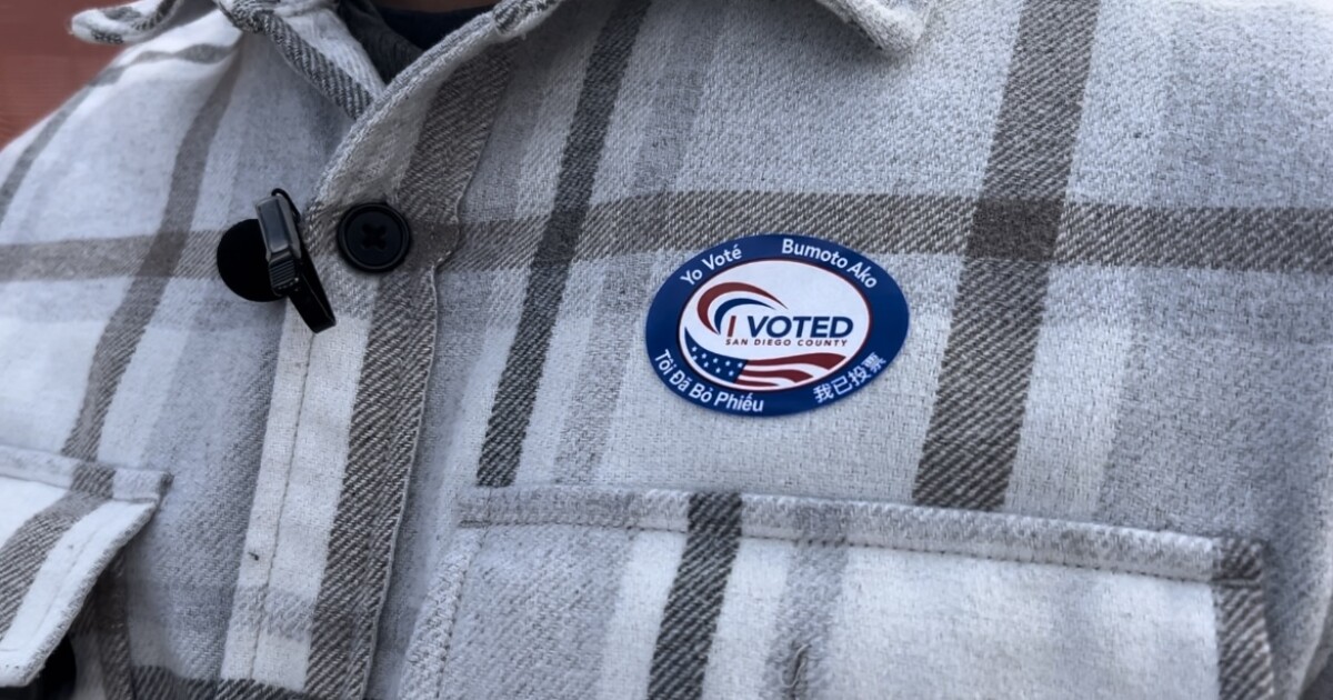 Local wearing "I Voted" sticker on an Election Day