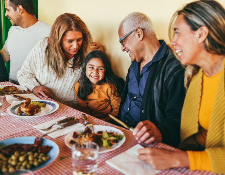 Family laughing and eating together