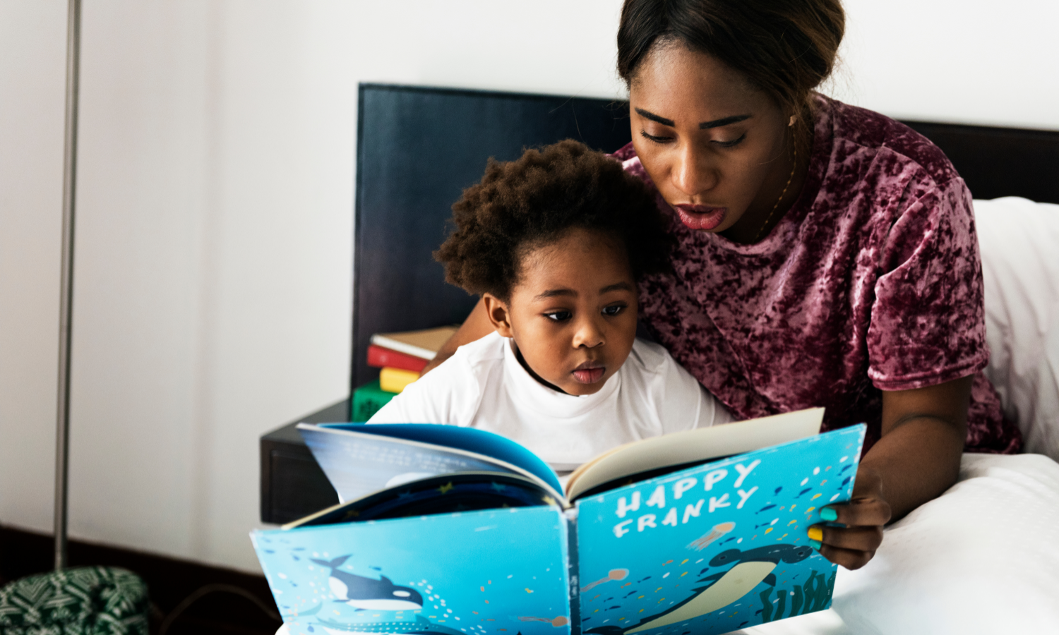 Mother reading to child at home