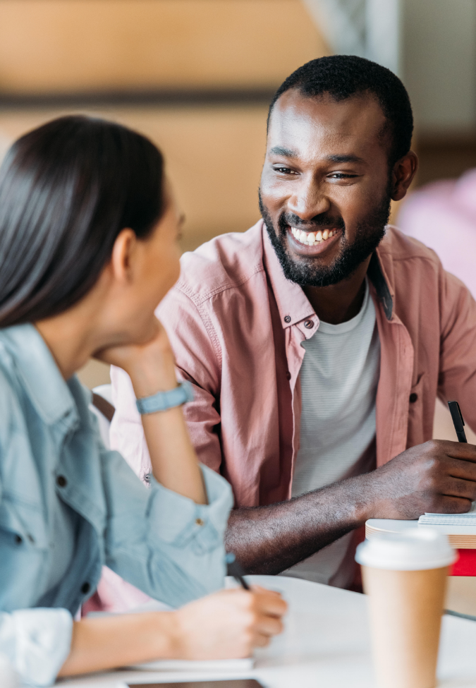 Woman and man smiling at each other