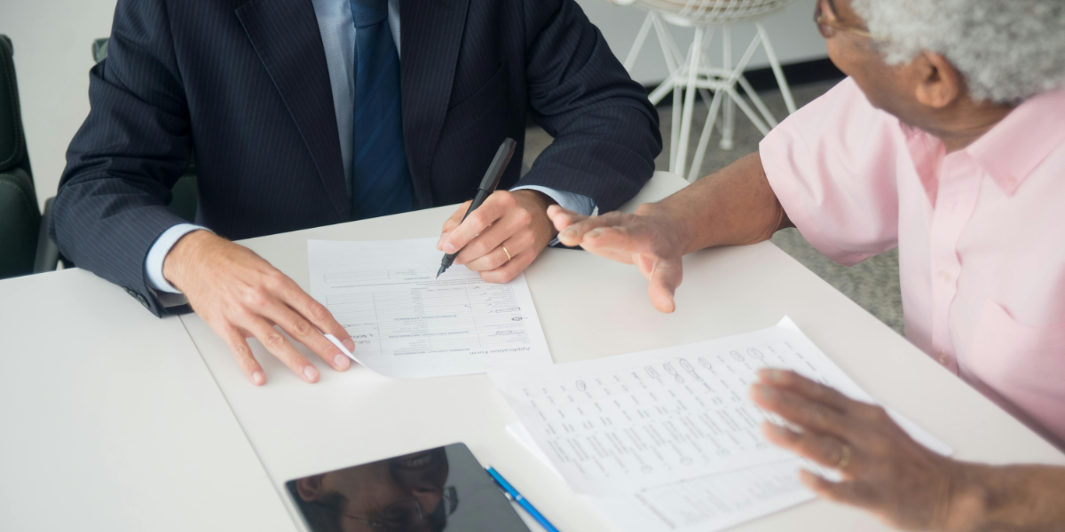 Older adult with finance advisor