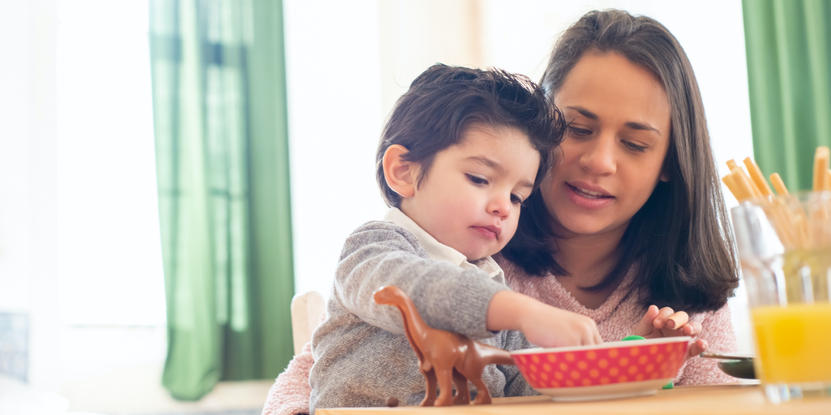 Young child eating at home