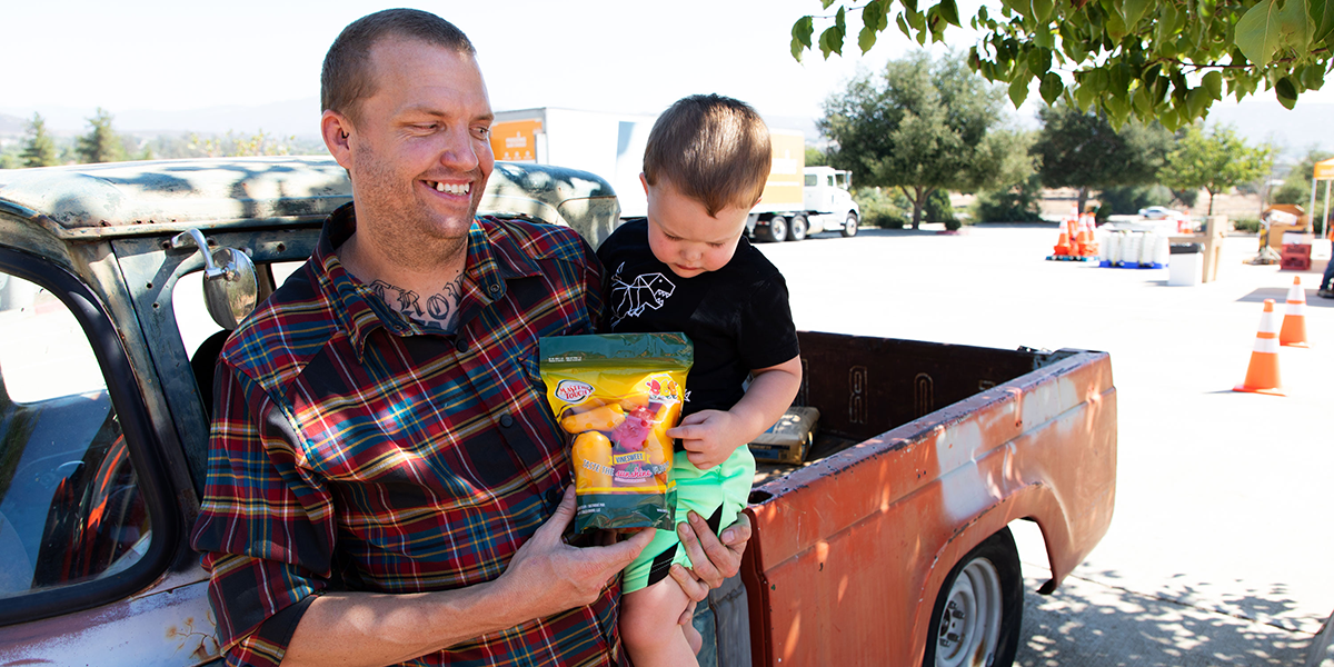 Father and child with sweet peppers