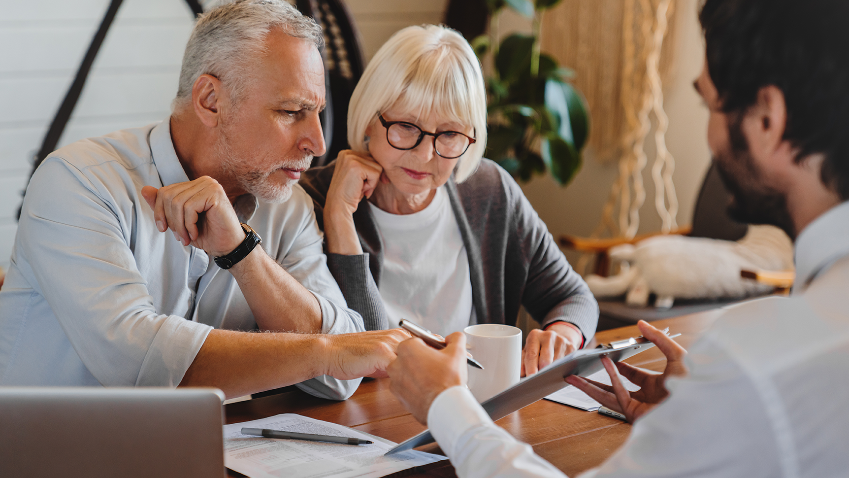 Financial Advisor showing paperwork to clients