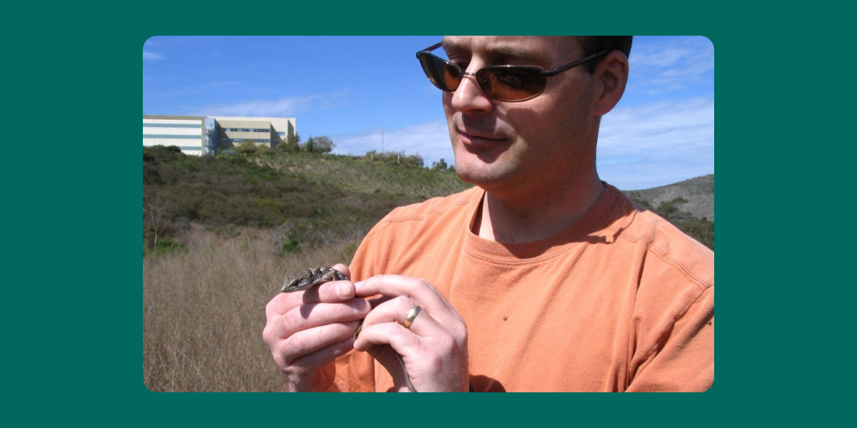 Keith Greer holding a San Diego alligator lizard. The species is native to the Pacific coast of North America and ranges from Baja California to the state of Washington