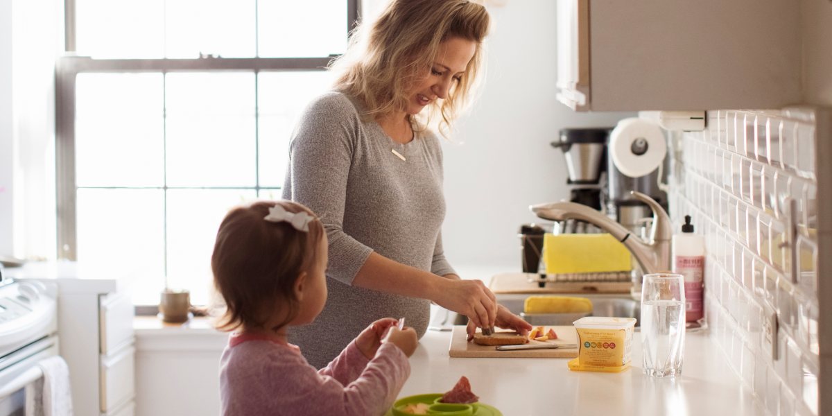 Mother and daughter in kitchen at home