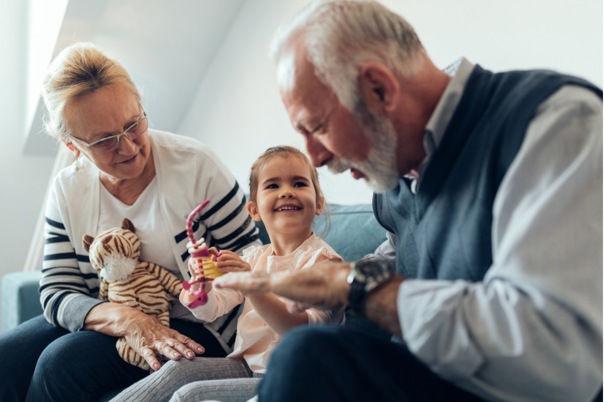 Grandparents and grandchild at home