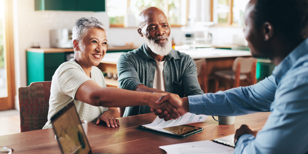 Woman shaking hands with a financial advisor
