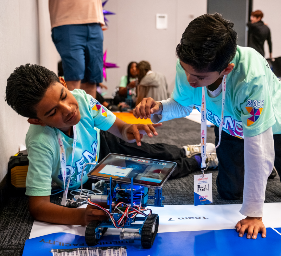 Greater Than Tech participants working on a robotics project
