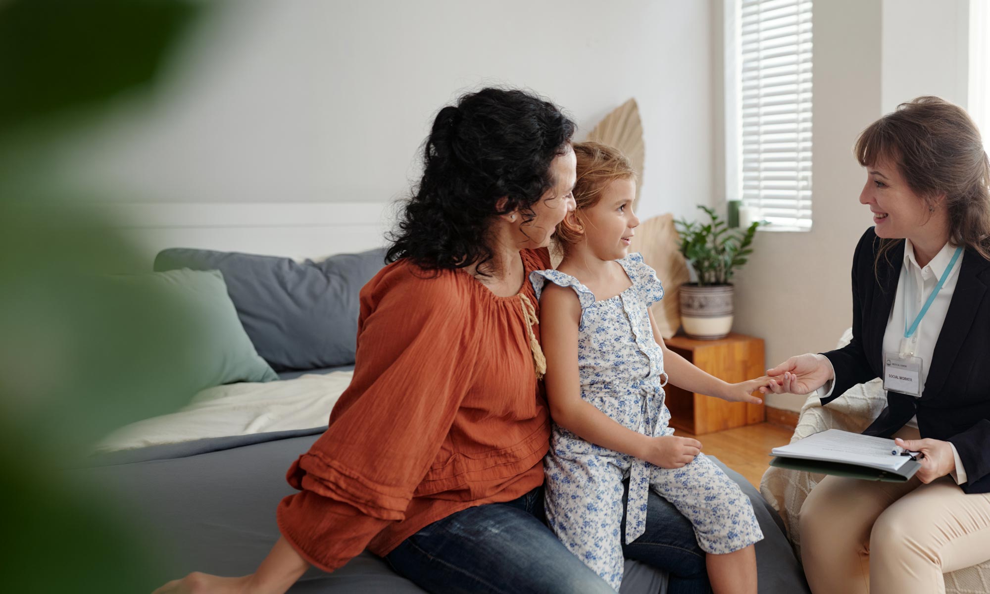 Child and parent with a therapist