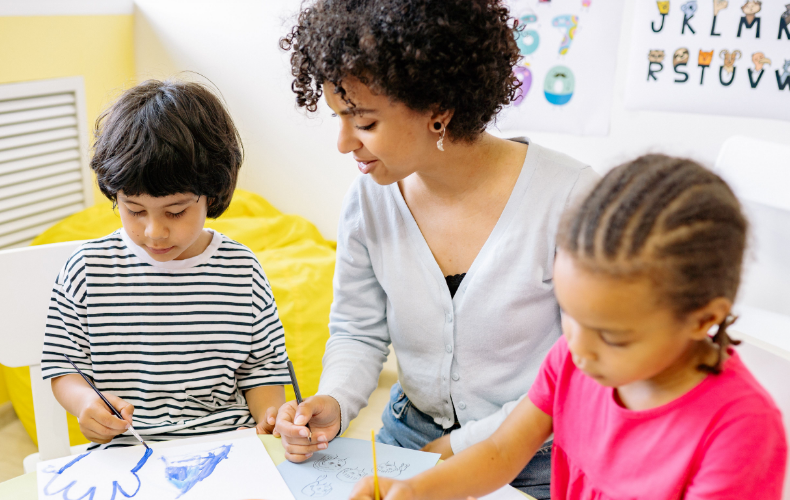 Daycare provider doing an activity with children