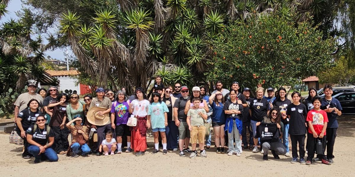 'ataaxum pomkwaan group photo outside